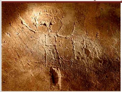 John the Baptist figure wearing animal skin arms up as in blessing with staff in one hand carved perhaps by third century monks or very early Christians
